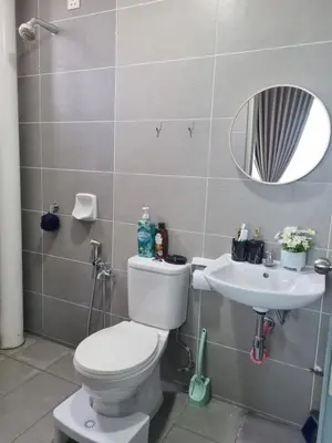 a bathroom with a toilet and a sink at NuTiQa Homestay Meru Ipoh Perak in Ipoh
