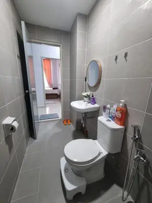 a bathroom with a toilet and a sink at NuTiQa Homestay Meru Ipoh Perak in Ipoh