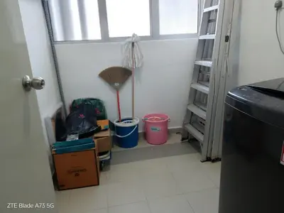 a hallway with a room with boxes and a broom at NuTiQa Homestay Meru Ipoh Perak in Ipoh