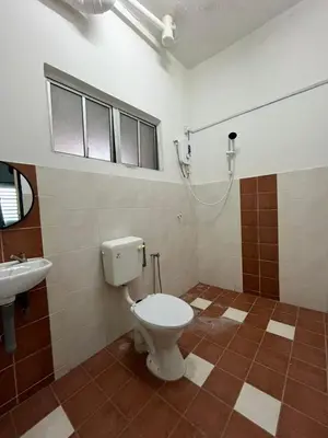 a bathroom with a toilet and a sink at Dsyahna homestay in Ipoh