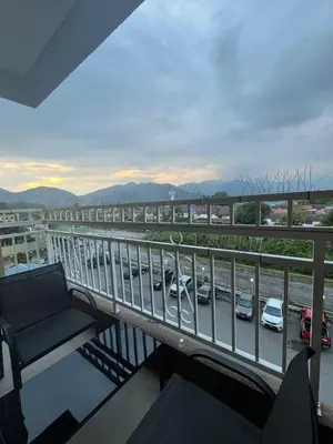 a balcony with a view of a parking lot with cars at Dsyahna homestay in Ipoh