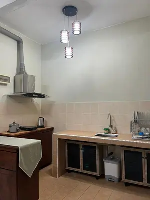 a kitchen with a sink and a counter top at Dsyahna homestay in Ipoh