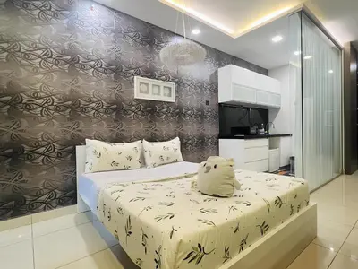a bedroom with a bed with a teddy bear on it at Mansion One l 5pax 1R1B l Cityview l Gleneagle l by PerfectSweetHome in George Town