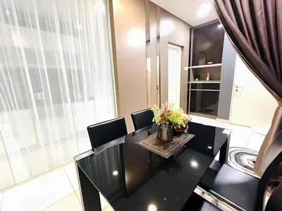 a dining room with a black table and chairs at Mansion One l 5pax 1R1B l Cityview l Gleneagle l by PerfectSweetHome in George Town