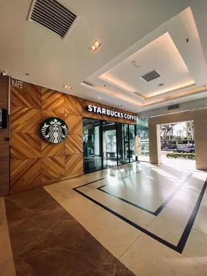 a shopping center with a starbucks sign on the wall at Mansion One l 5pax 1R1B l Cityview l Gleneagle l by PerfectSweetHome in George Town