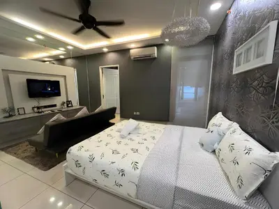 a bedroom with a bed and a living room at Mansion One l 5pax 1R1B l Cityview l Gleneagle l by PerfectSweetHome in George Town