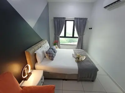 a bedroom with a large bed and a window at The Horizon Ipoh Belle Vue by Grab A Stay in Ipoh
