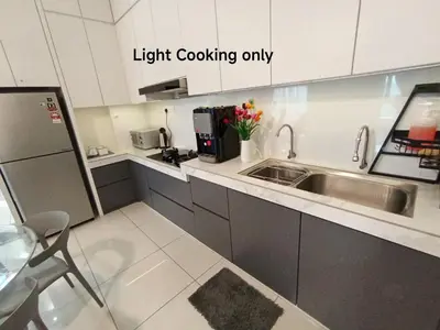 a kitchen with a sink and a counter top at The Horizon Ipoh Belle Vue by Grab A Stay in Ipoh