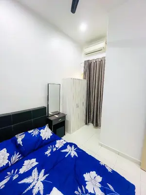 a bedroom with a blue and white bed and a mirror at JaszSpace at Kulim Hi-Tech - All Room Aircond,Wifi,Netflix in Kulim