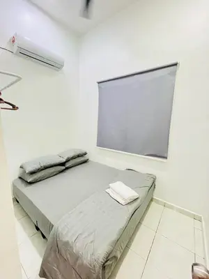 a white room with two beds and a window at JaszSpace at Kulim Hi-Tech - All Room Aircond,Wifi,Netflix in Kulim
