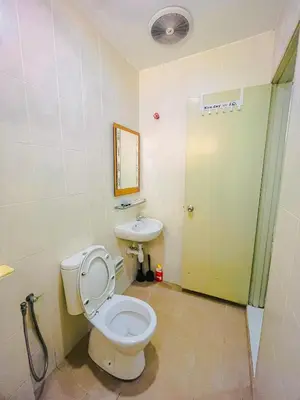 a bathroom with a toilet and a sink at JaszSpace at Kulim Hi-Tech - All Room Aircond,Wifi,Netflix in Kulim
