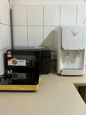a microwave sitting on a counter next to a toaster at New! 9 pax Georgetown Heritage Pre-war House 3BR in George Town