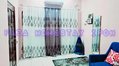 a room with a curtain and a sign that says a house stay at Faza Homestay Meru Ipoh in Ipoh