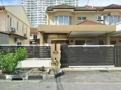 a house with a fence in front of it at Bayan Baru in Bayan Lepas