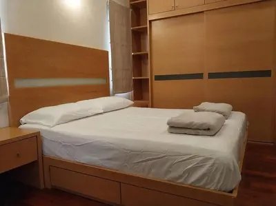 a bed with two pillows on it in a bedroom at Bayan Baru in Bayan Lepas
