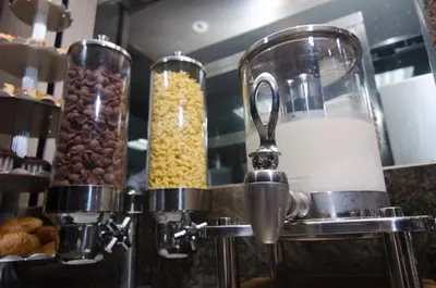 a counter with two containers of cereal and nuts at WEIL Hotel Ipoh in Ipoh