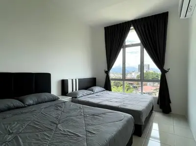 a bedroom with two beds and a large window at Premier Family Suite & City View Seven Houz Ipoh in Ipoh