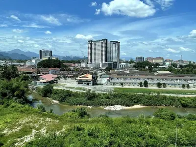 a view of a city with a river and buildings at Premier Family Suite & City View Seven Houz Ipoh in Ipoh