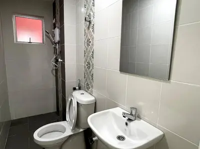 a bathroom with a toilet and a sink at Premier Family Suite & City View Seven Houz Ipoh in Ipoh