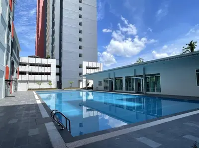 a large swimming pool in the middle of a building at Premier Family Suite & City View Seven Houz Ipoh in Ipoh