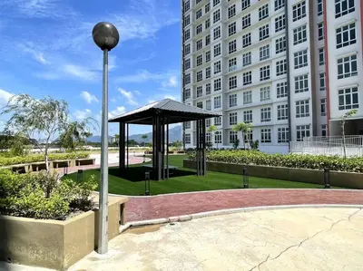 a gazebo in a park in front of a building at Premier Family Suite & City View Seven Houz Ipoh in Ipoh