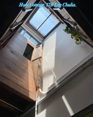 a skylight in a house with a window at Homs Female Hostel in George Town