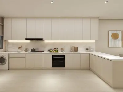 a kitchen with white cabinets and a black dishwasher at Booyen hills in Tanah Rata