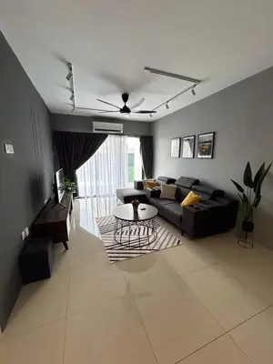 a living room with a couch and a table at Booyen hills in Tanah Rata