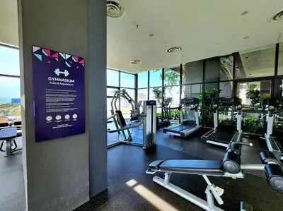 a gym with cardio equipment in a building at Seaview Studio Tropicana 218 Macalister Georgetown in George Town