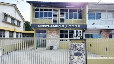 a house with a sign that reads scotland lodge at Scotland 18 Lodge in George Town