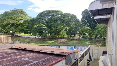a view of a park from the balcony of a building at Scotland 18 Lodge in George Town