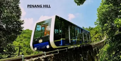 a train traveling on a bridge over a hill at Scotland 18 Lodge in George Town
