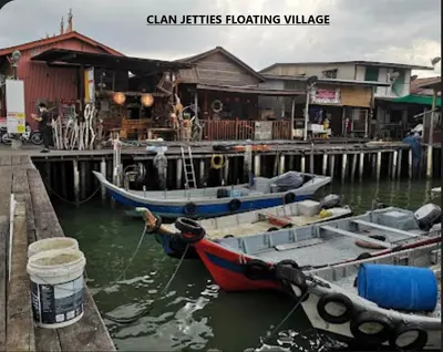 two boats tied to a dock in the water at Scotland 18 Lodge in George Town