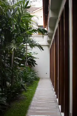 a corridor of a building with plants and a walkway at Muntri Grove in George Town