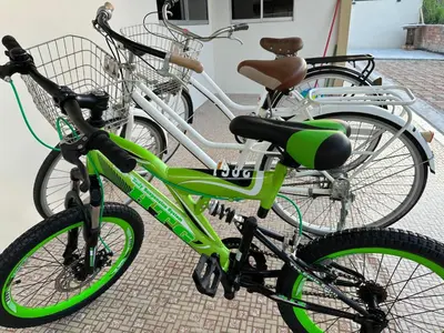 two bikes are parked next to each other at UncleLiew Cozy Home \u8001\u5218\u6c11\u5bbf in Sekincan