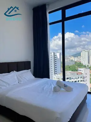 a bedroom with a bed and a large window at Beacon 2BR Infinity Pool - By BNB4U in George Town