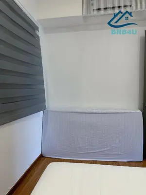 a bed in a room with a mattress at Beacon 2BR Infinity Pool - By BNB4U in George Town