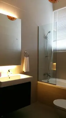 a bathroom with a sink and a shower at Beach Front Bungalow Tanjung Bungah in George Town