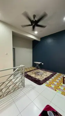 a room with a ceiling fan and a bed at Homestay Bagan Serai in Bagan Serai