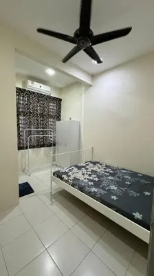 a bedroom with a bed and a ceiling fan at Homestay Bagan Serai in Bagan Serai