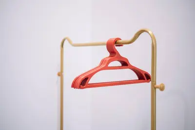 a red hanger hanging from a metal pole at Seaview Infinity Pool 3BR 2Carparks 8Pax 401 in Jelutong