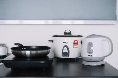 a kitchen counter with two appliances on a table at Seaview Infinity Pool 3BR 2Carparks 8Pax 401 in Jelutong