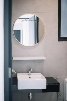 a bathroom with a white sink and a mirror at Seaview Infinity Pool 3BR 2Carparks 8Pax 401 in Jelutong