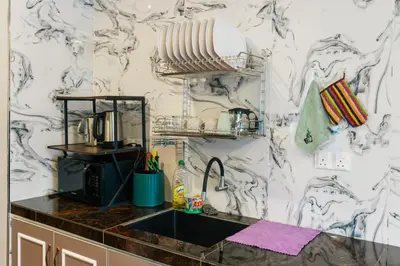 a kitchen with a sink and a counter top at Hotel Lavie at Centrum in Brinchang