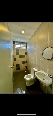a bathroom with a toilet and a sink at Aura Homestay in Sungai Petani
