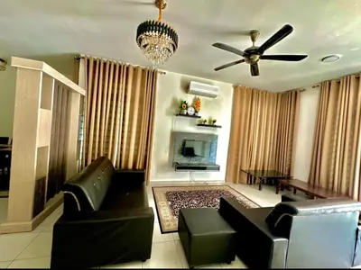 a living room with a couch and a ceiling fan at Aura Homestay in Sungai Petani