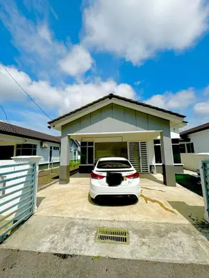 a white car parked in front of a house at Aura Homestay in Sungai Petani