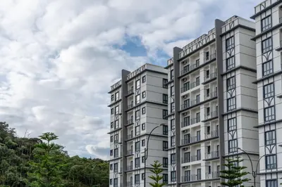 a rendering of a tall apartment building at Zenith Suites Cameron in Tanah Rata
