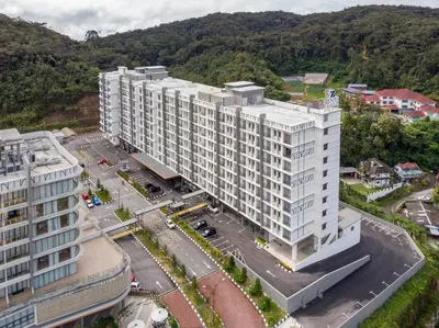 an aerial view of a large white building at Zenith Suites Cameron in Tanah Rata