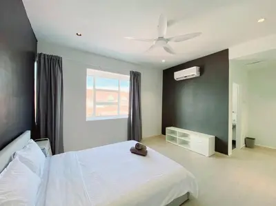 a bedroom with a white bed and a ceiling fan at IKEA Modernism House 10Pax`Near Icon City in Bukit Mertajam
